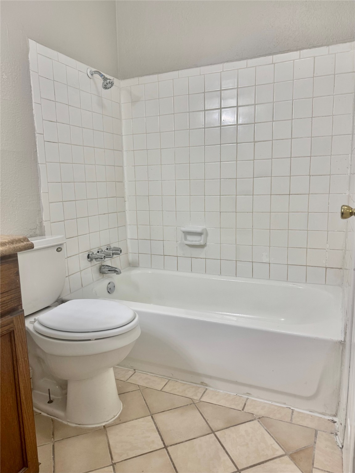 9413 Hollock Street, Unit B Houston, TX 77075 - Photo 12 of 12 a bathroom with a toilet and a bathtub