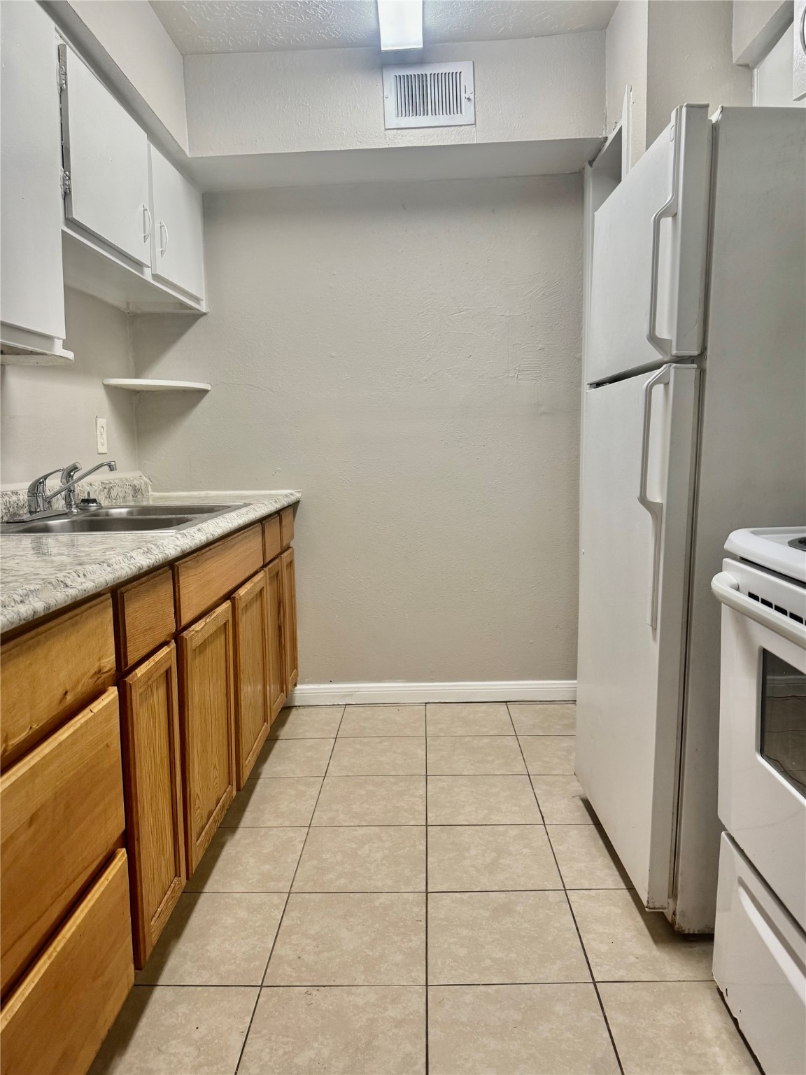 9413 Hollock Street, Unit B Houston, TX 77075 - Photo 5 of 12 a view of a kitchen with a sink