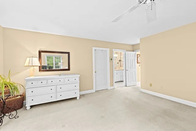 a view of room with cabinet and windows