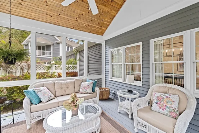 a outdoor living area with furniture and a large window