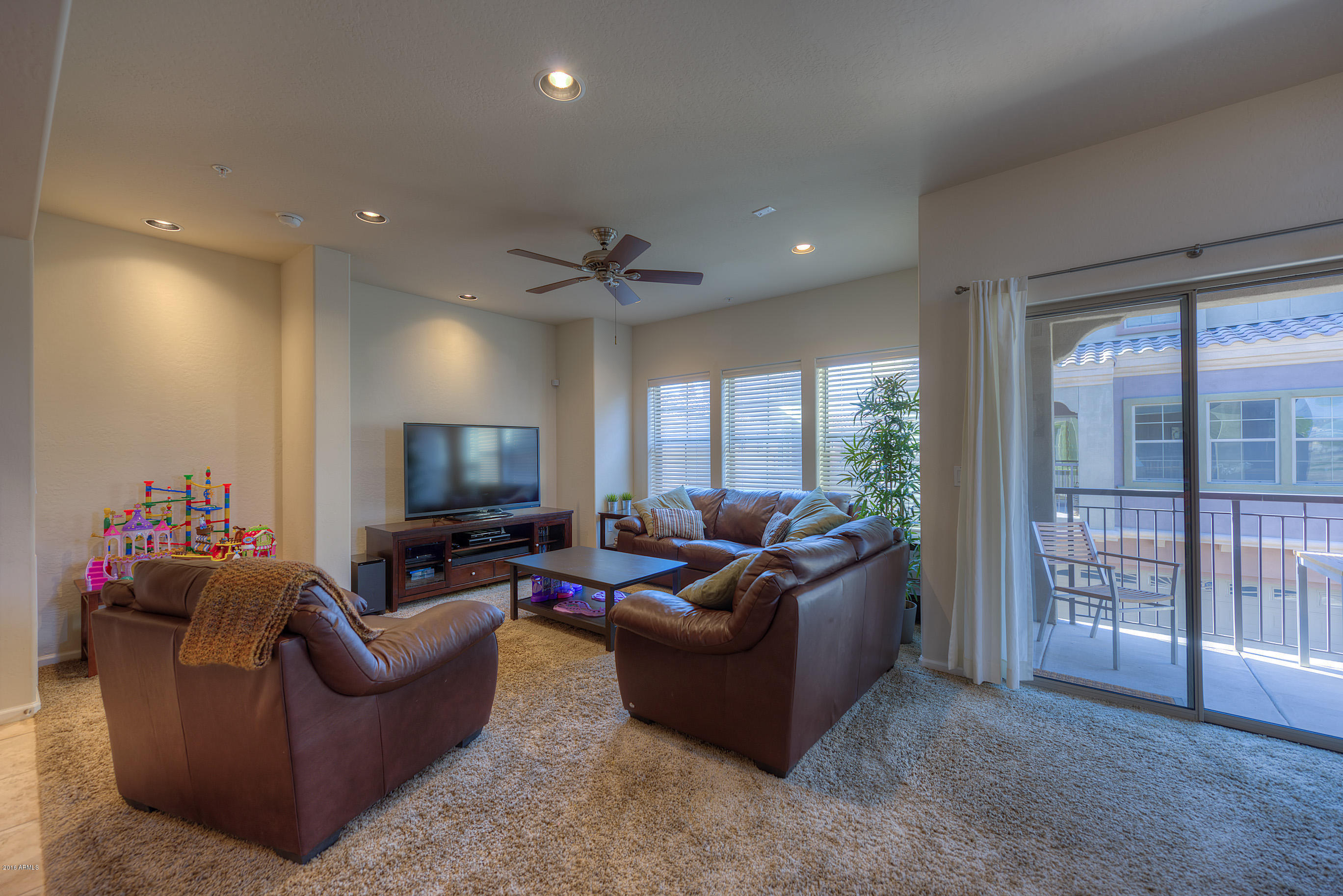 3935 East Rough Rider Road, Unit 1196 Phoenix, AZ 85050 - Photo 5 of 14 005_Living Room and Patio