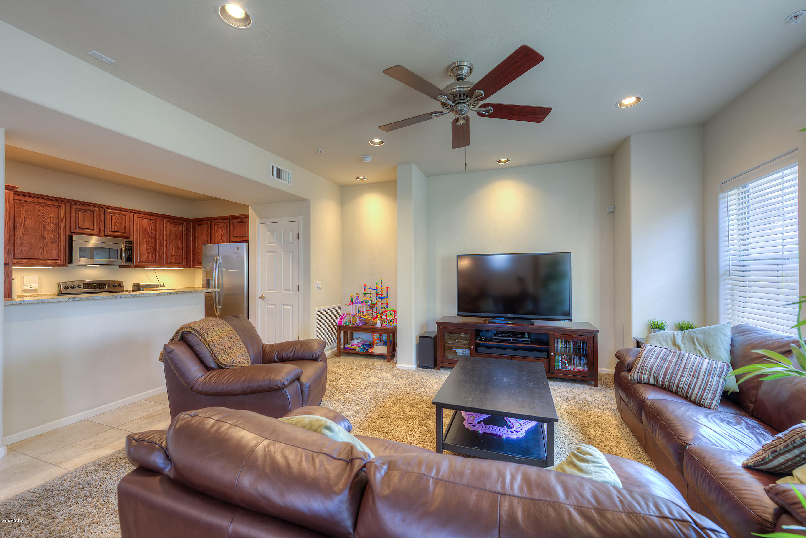3935 East Rough Rider Road, Unit 1196 Phoenix, AZ 85050 - Photo 6 of 14 006_Living Room and Kitchen