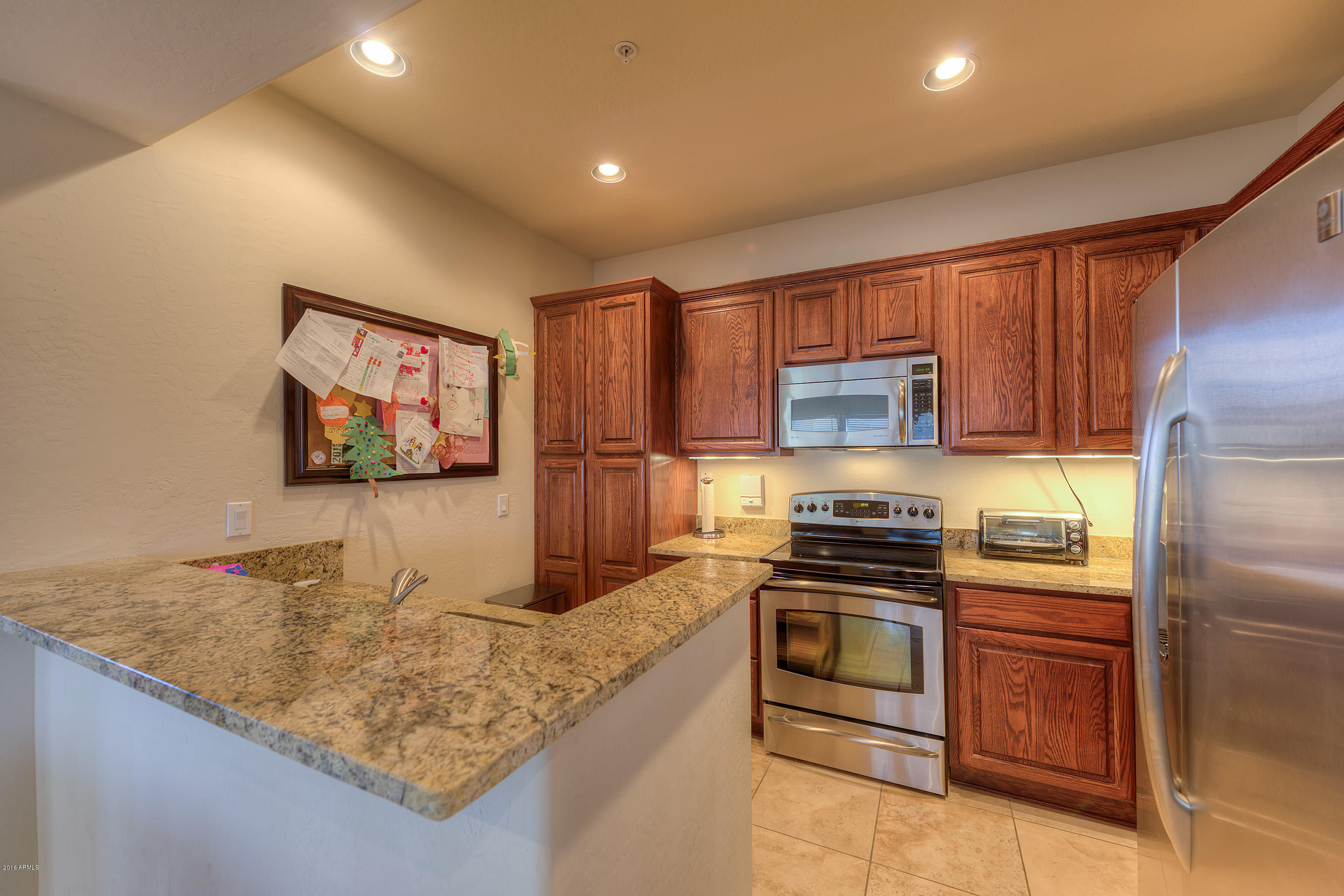 3935 East Rough Rider Road, Unit 1196 Phoenix, AZ 85050 - Photo 9 of 14 009_Kitchen with Stainless Appliance