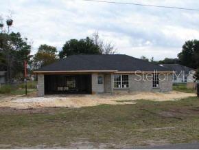 9754 Bahia Road Ocala, FL 34472 - Photo 1 of 1 a front view of a house with a yard