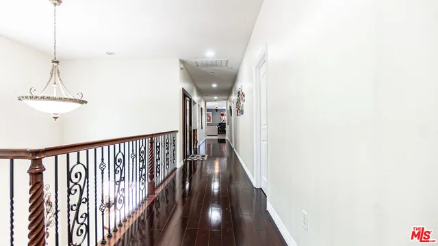 a bedroom with a bed and a flat screen tv in it