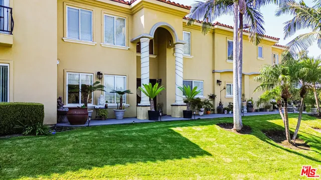 a living room with furniture fireplace and flat screen tv