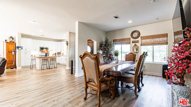a view of living room with furniture and a fireplace