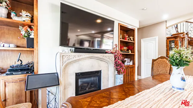 a kitchen with stainless steel appliances a stove refrigerator sink and microwave