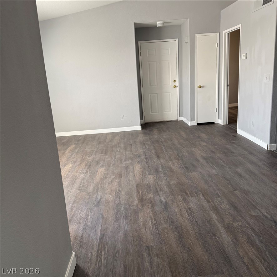 1830 North Pecos Road, Unit 258 Las Vegas, NV 89115 - Photo 12 of 14 Rich wood-look flooring extends throughout this versatile living space.