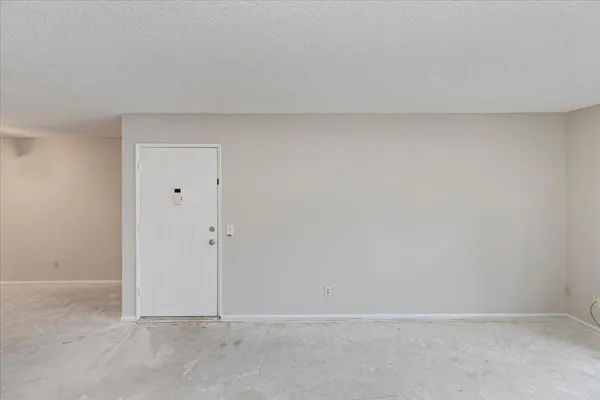 a view of a kitchen with a sink and a refrigerator
