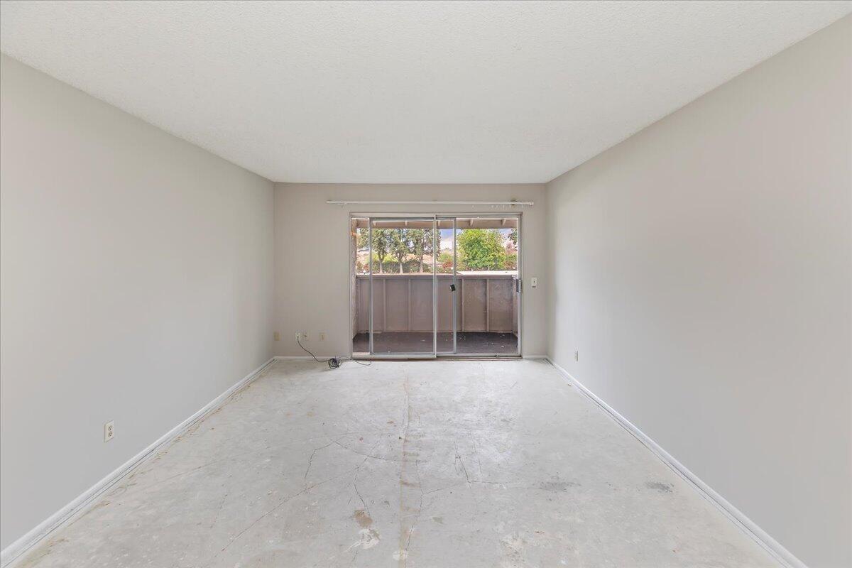 26200 Redlands Boulevard, Unit 68 Redlands, CA 92373 - Photo 12 of 32 an empty room with windows