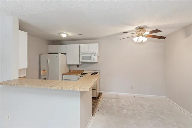 a room with furniture a table and chair