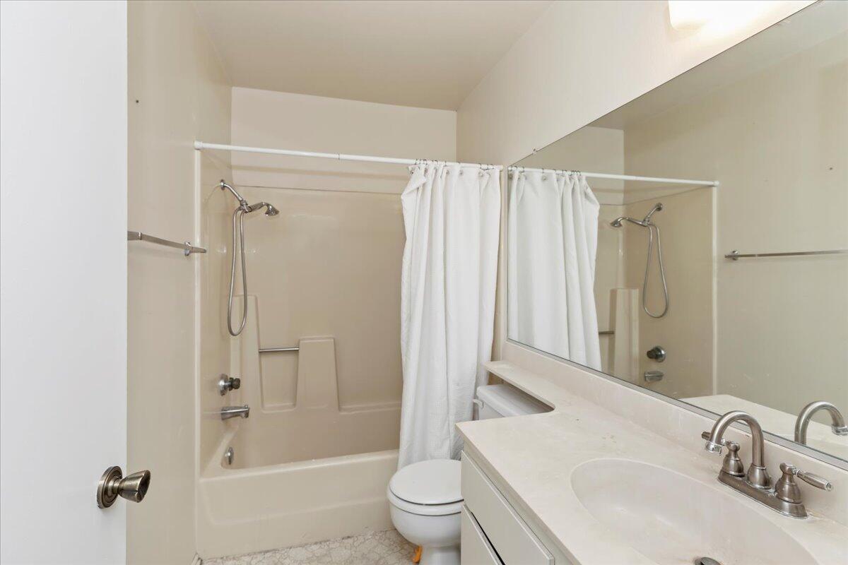 26200 Redlands Boulevard, Unit 68 Redlands, CA 92373 - Photo 22 of 32 a bathroom with a sink a toilet and shower
