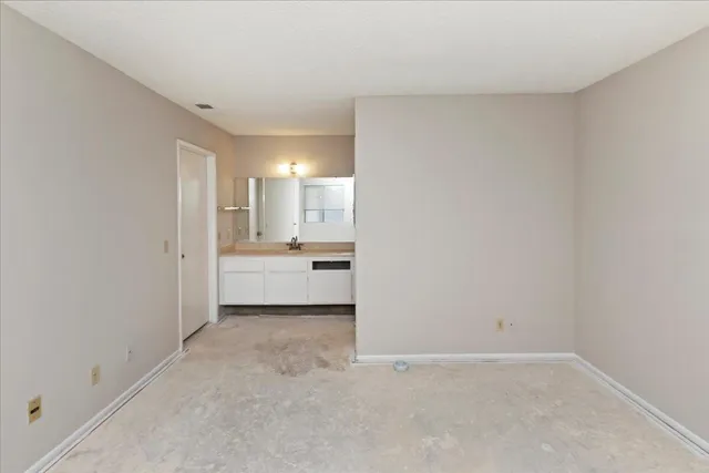 a white toilet sitting next to a bath tub shower