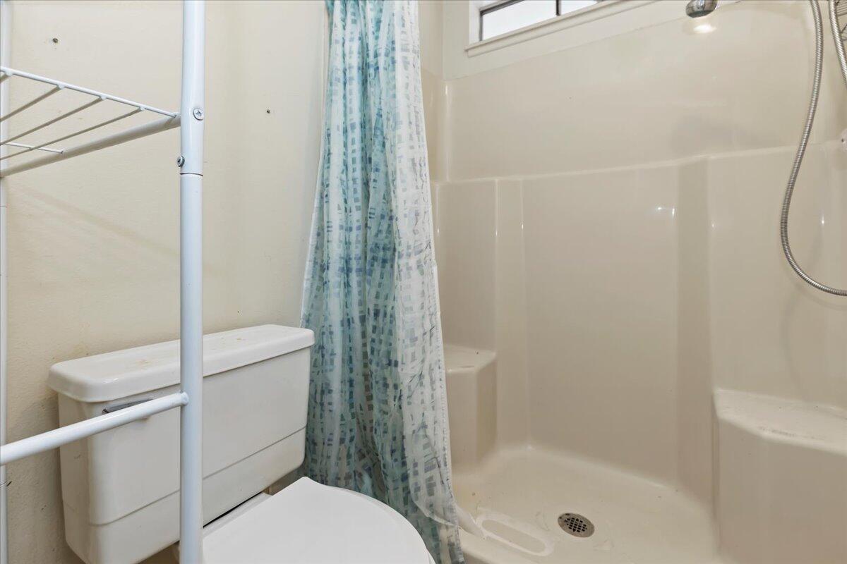 26200 Redlands Boulevard, Unit 68 Redlands, CA 92373 - Photo 29 of 32 a white toilet sitting next to a bath tub shower