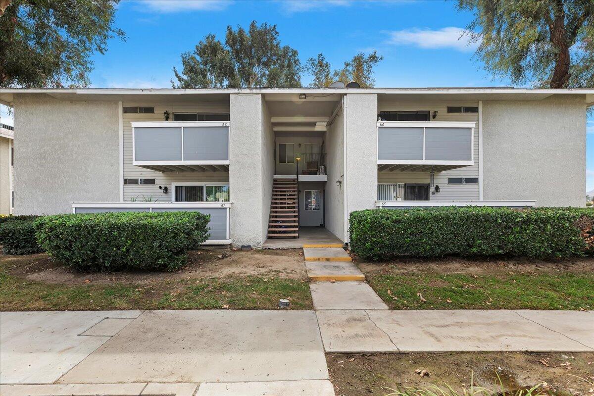 26200 Redlands Boulevard, Unit 68 Redlands, CA 92373 - Photo 6 of 32 a view of a house with a yard