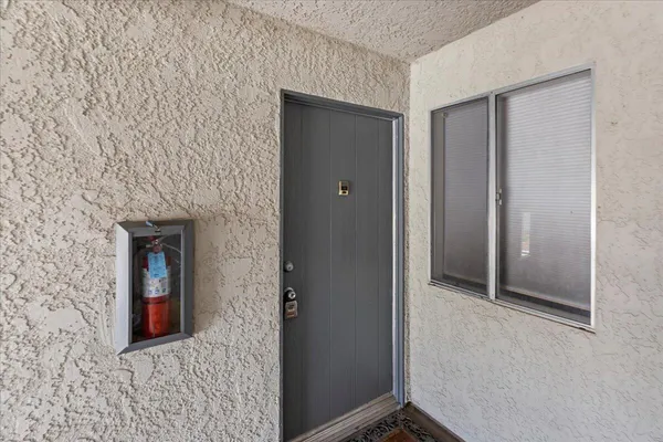 a view of balcony with furniture