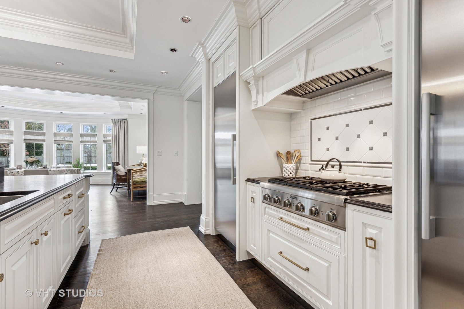375 Old Farm Road Northfield, IL 60093 - Photo 18 of 78 a kitchen with stainless steel appliances granite countertop a stove and a refrigerator