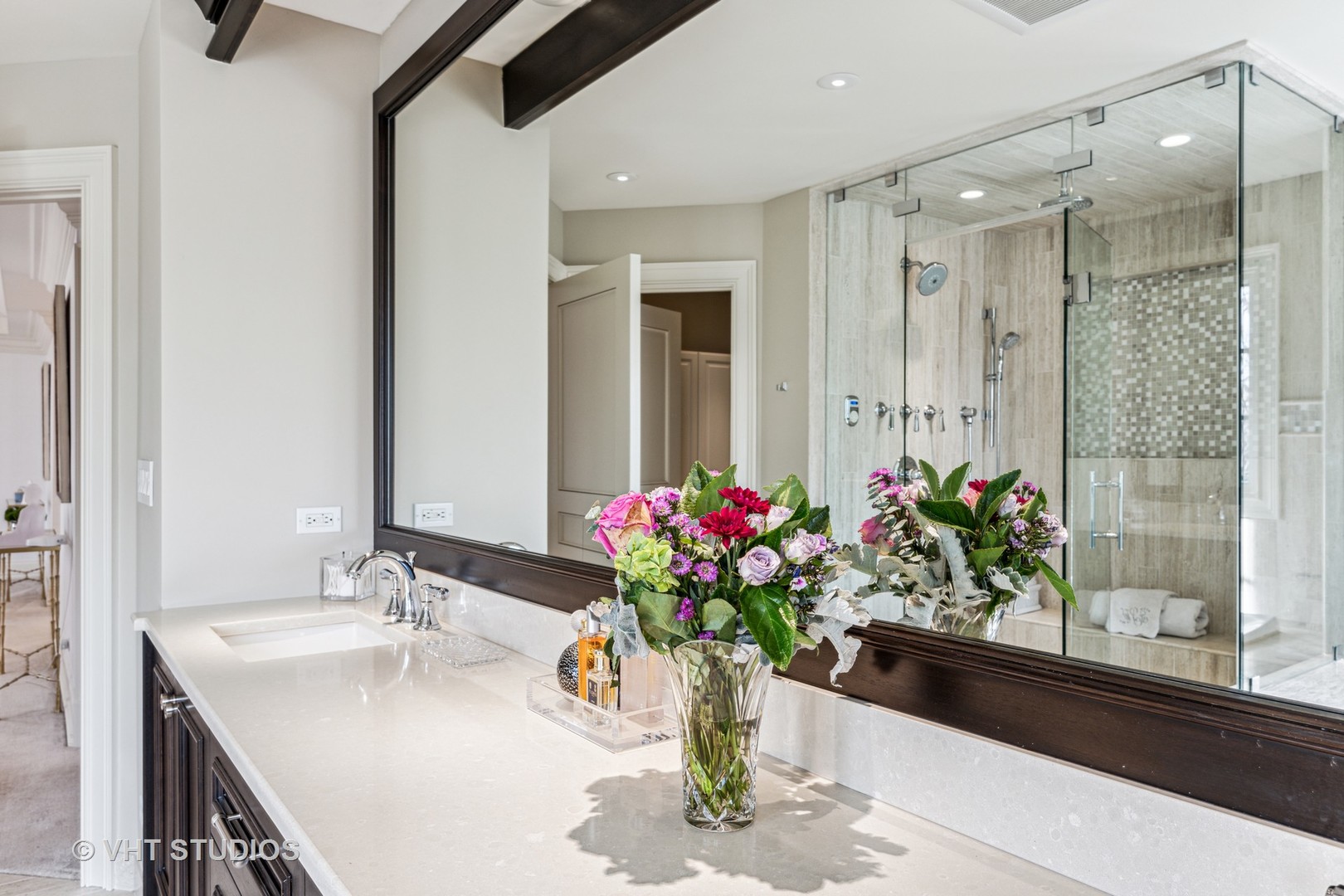 375 Old Farm Road Northfield, IL 60093 - Photo 37 of 78 a bathroom with a granite countertop sink a large mirror and a shower