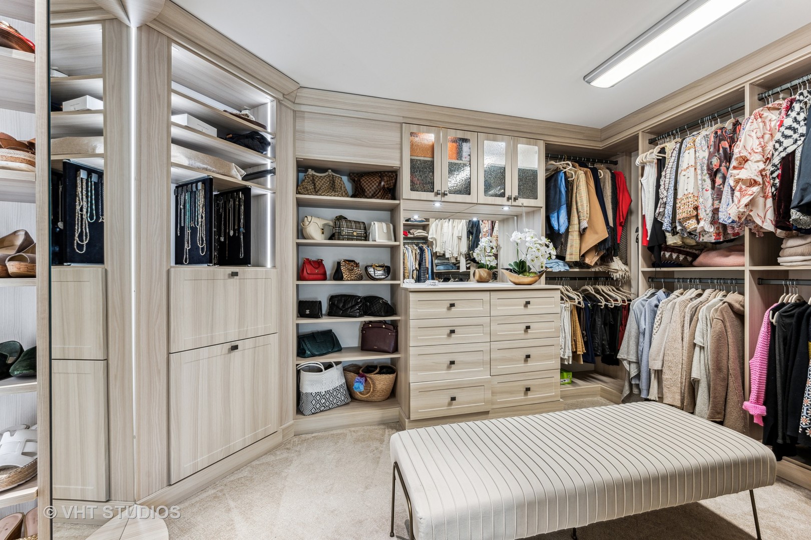 375 Old Farm Road Northfield, IL 60093 - Photo 39 of 78 a view of walk in closet with clothes and shoes