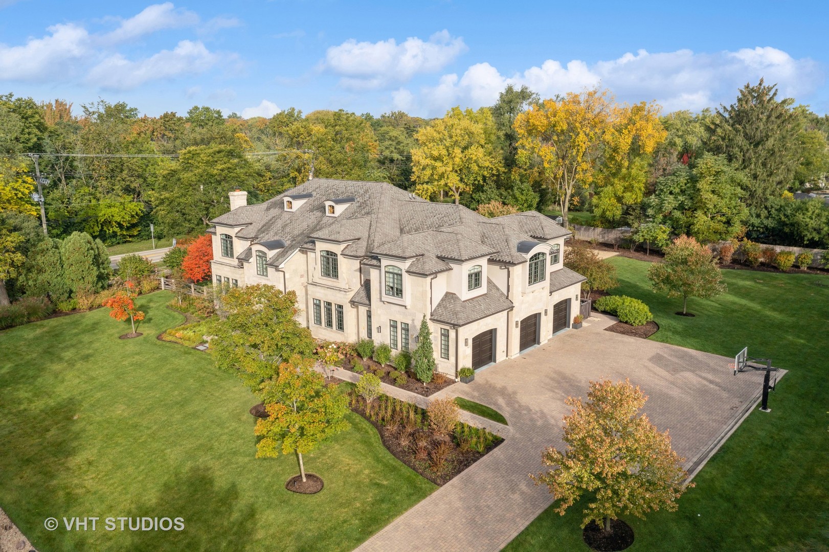 375 Old Farm Road Northfield, IL 60093 - Photo 69 of 78 a view of a white house with a big yard plants and large trees