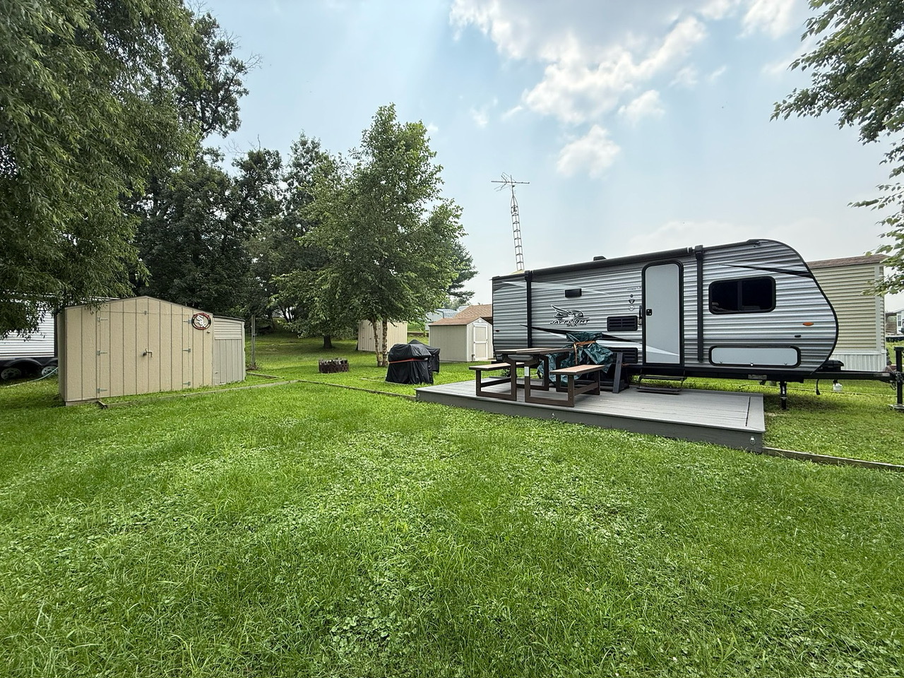 a view of a backyard with sitting area