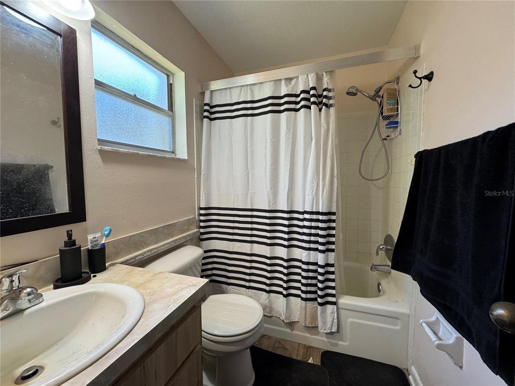 1703 North Taylor Road Brandon, FL 33510 - Photo 27 of 32 a bathroom with a sink a toilet and shower