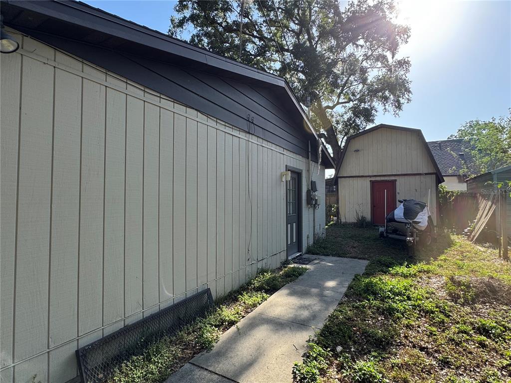 1703 North Taylor Road Brandon, FL 33510 - Photo 3 of 32 a front view of a house with garden