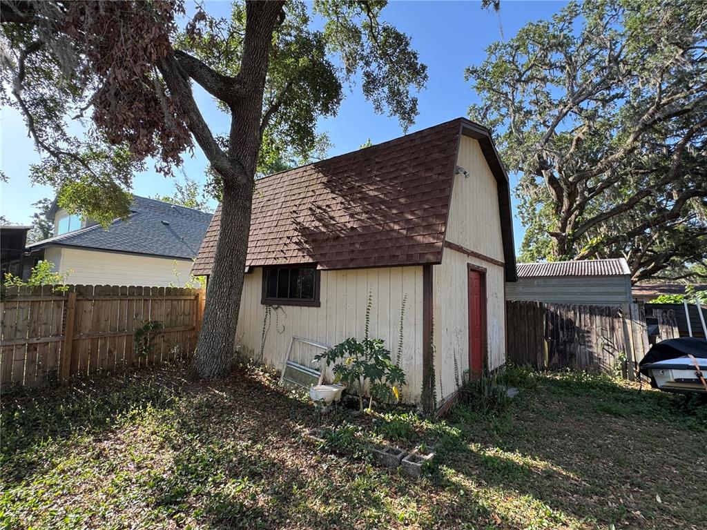 1703 North Taylor Road Brandon, FL 33510 - Photo 6 of 32 a front view of a house with garden