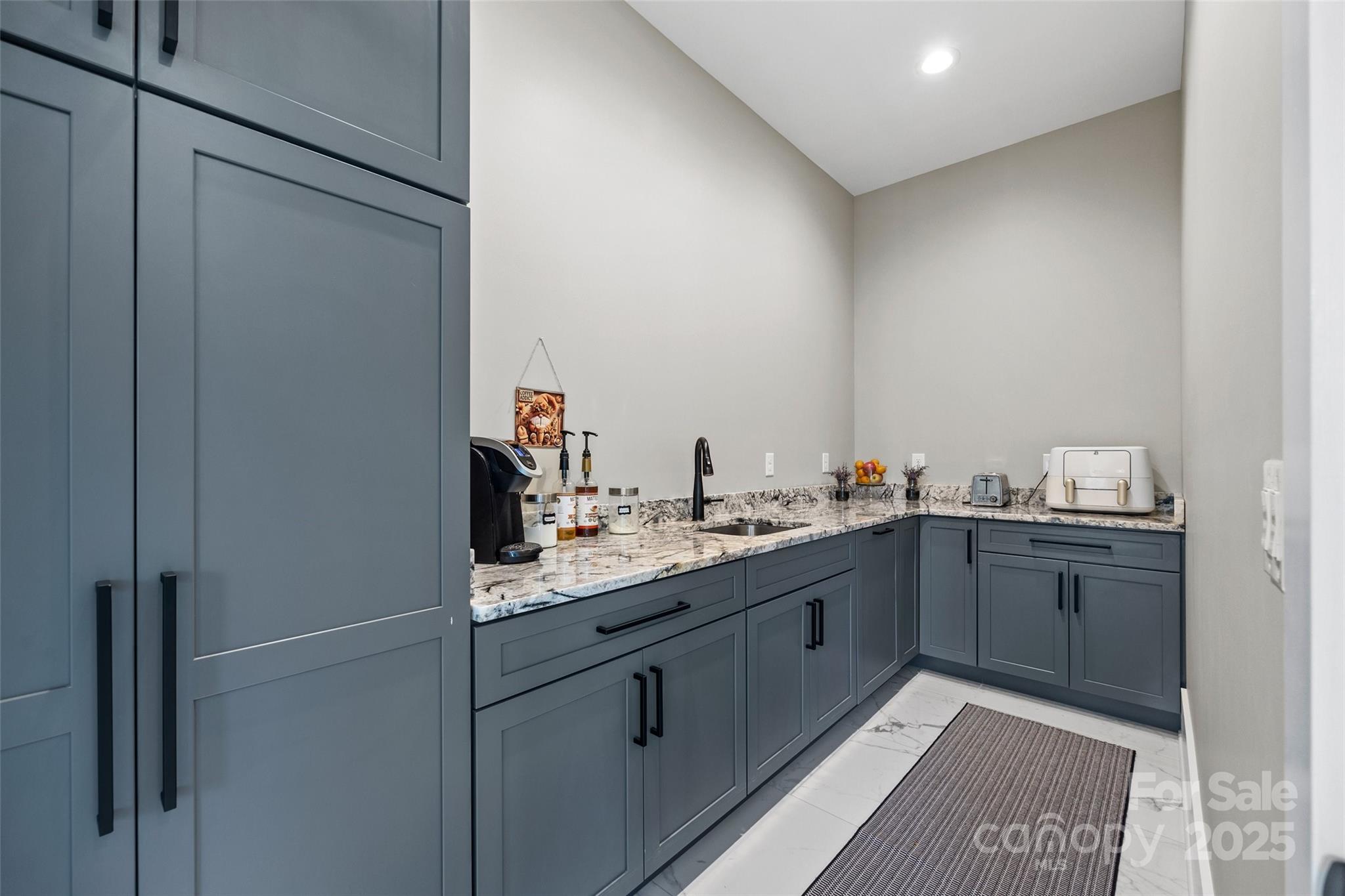 385 Squirrel Lane Lake Wylie, SC 29710 - Photo 11 of 48 a kitchen with a sink and cabinets
