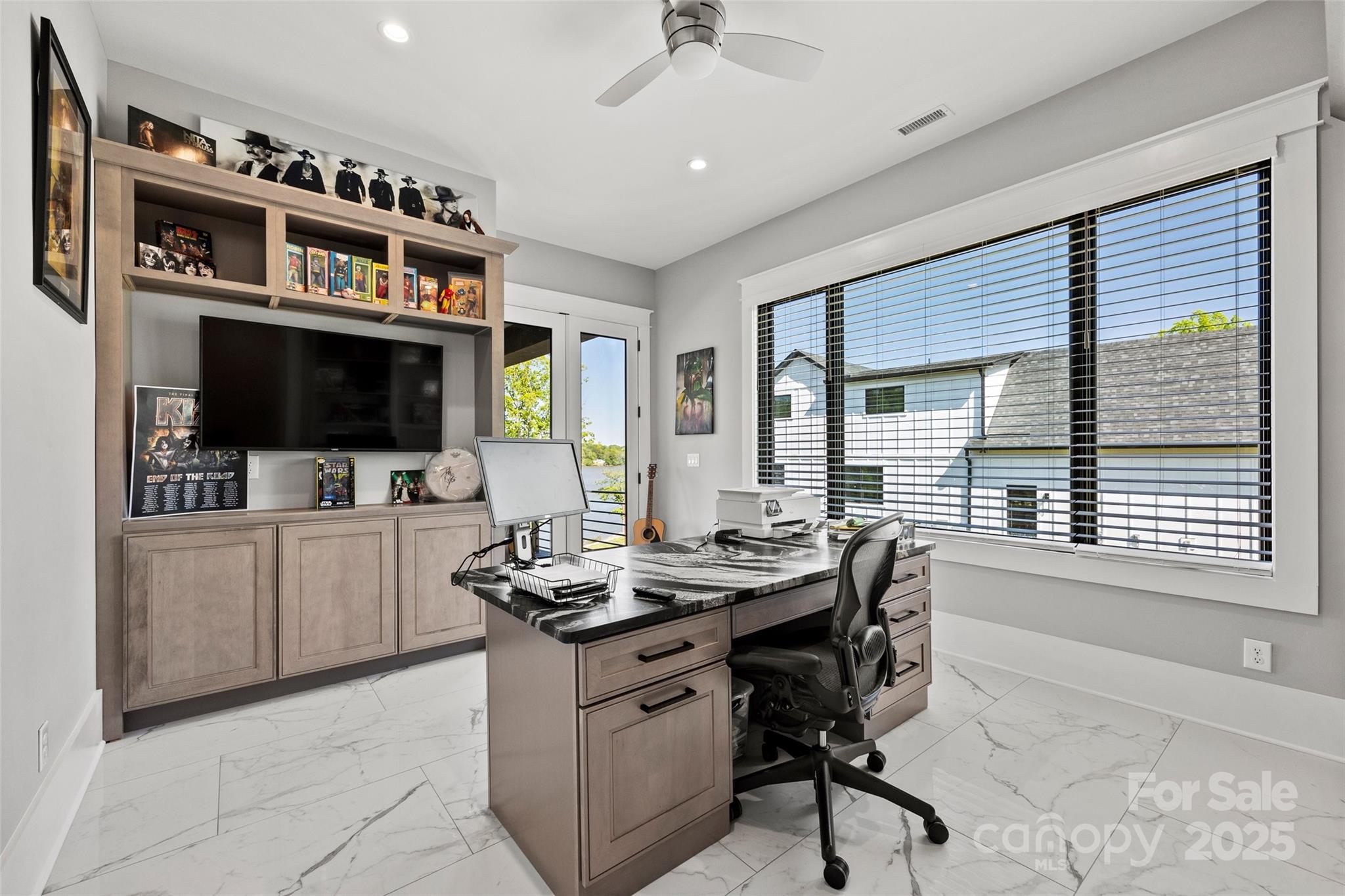 385 Squirrel Lane Lake Wylie, SC 29710 - Photo 14 of 48 a kitchen with stainless steel appliances kitchen island granite countertop a stove a sink and a microwave