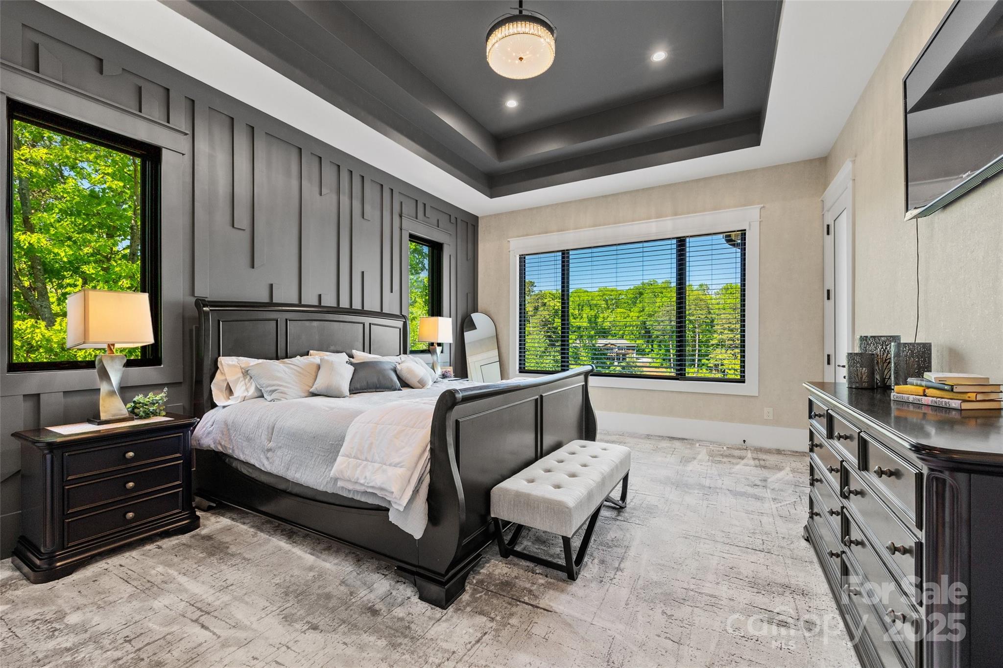 385 Squirrel Lane Lake Wylie, SC 29710 - Photo 15 of 48 a bedroom with a bed and large windows