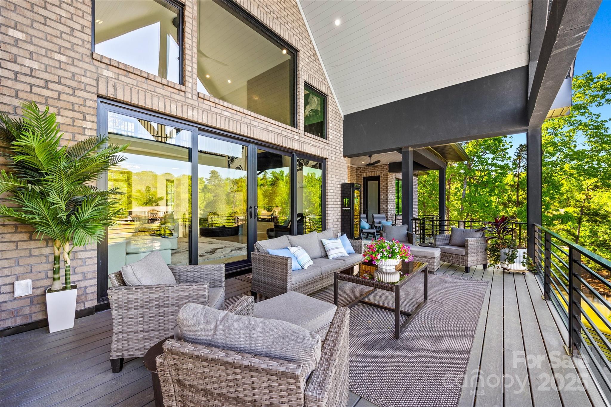 385 Squirrel Lane Lake Wylie, SC 29710 - Photo 22 of 48 a living room with furniture and floor to ceiling windows