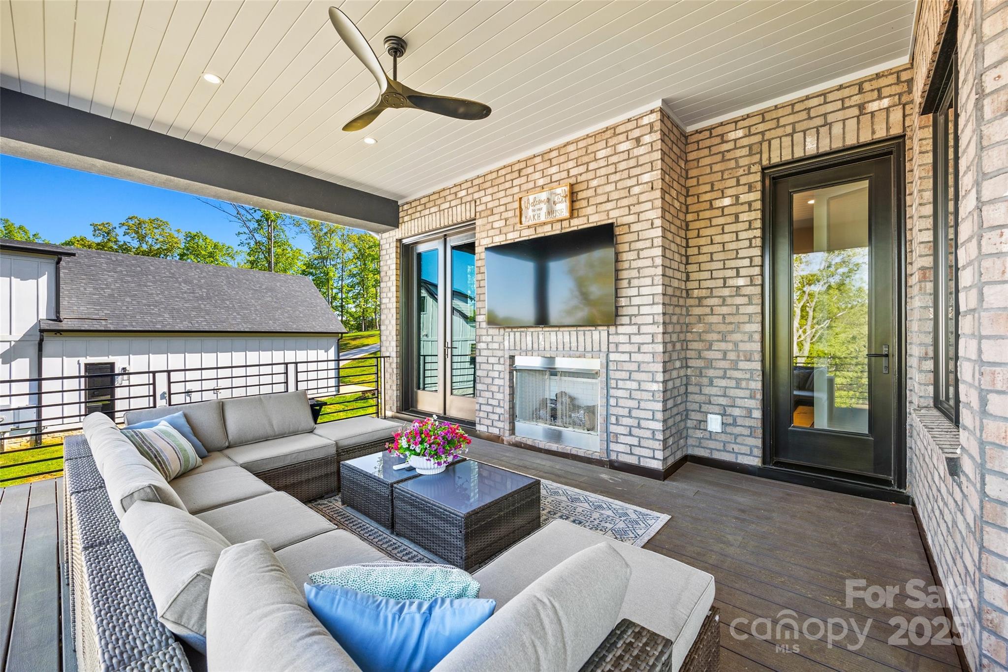 385 Squirrel Lane Lake Wylie, SC 29710 - Photo 23 of 48 a living room with furniture and a flat screen tv