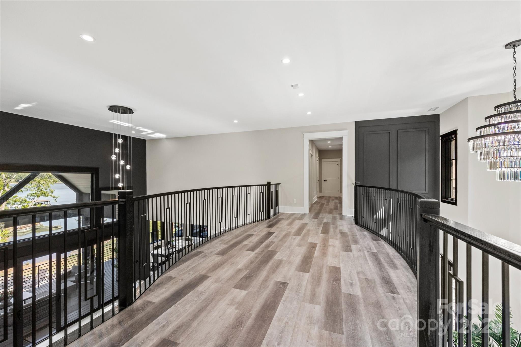 385 Squirrel Lane Lake Wylie, SC 29710 - Photo 25 of 48 a view of hallway with wooden floor and windows