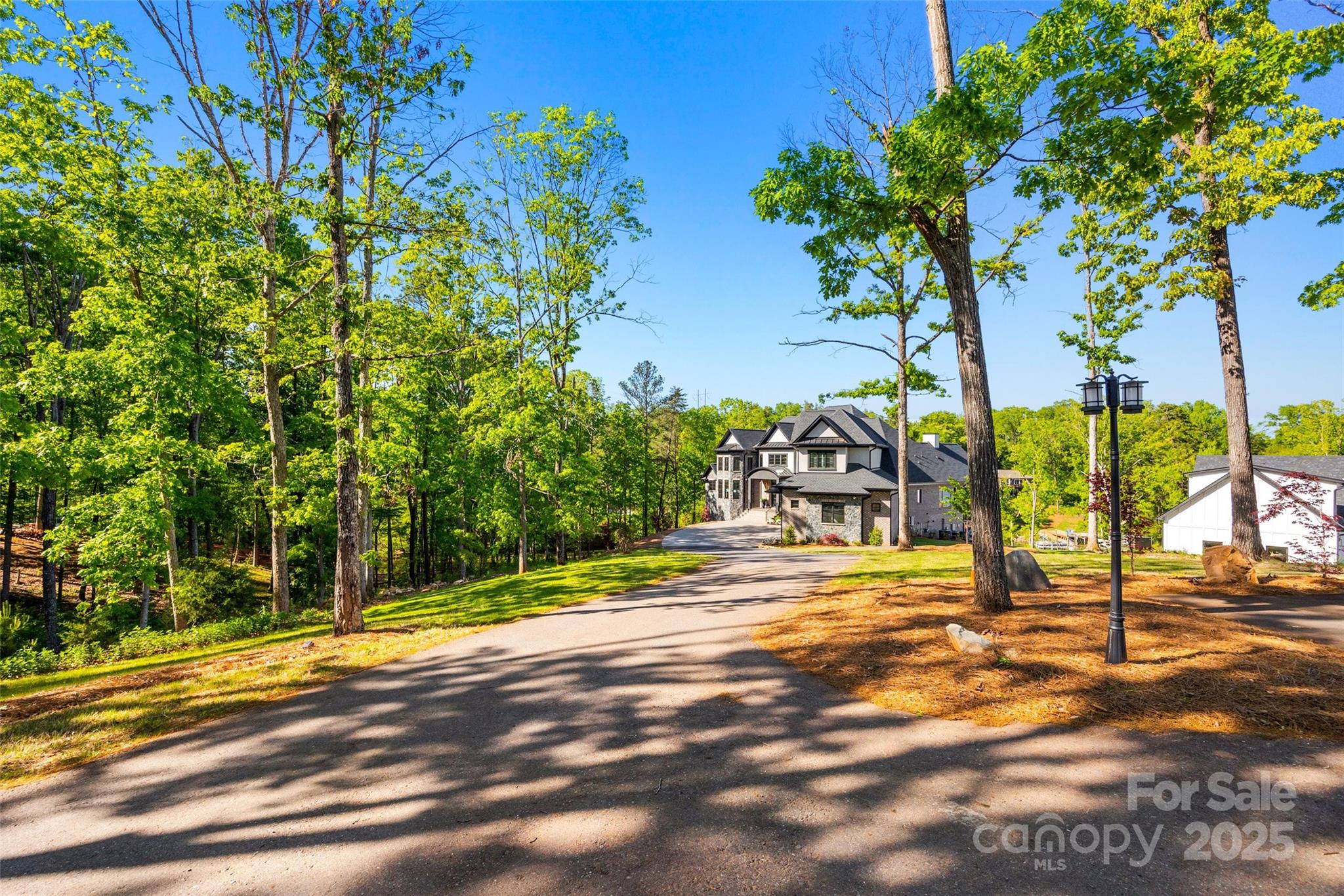 385 Squirrel Lane Lake Wylie, SC 29710 - Photo 3 of 48 a view of a swimming pool with an outdoor space and seating area