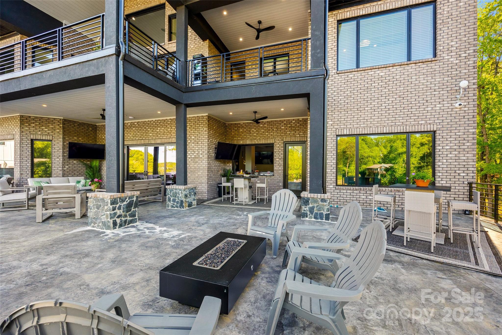 385 Squirrel Lane Lake Wylie, SC 29710 - Photo 36 of 48 a view of a patio with couches table and chairs and potted plants