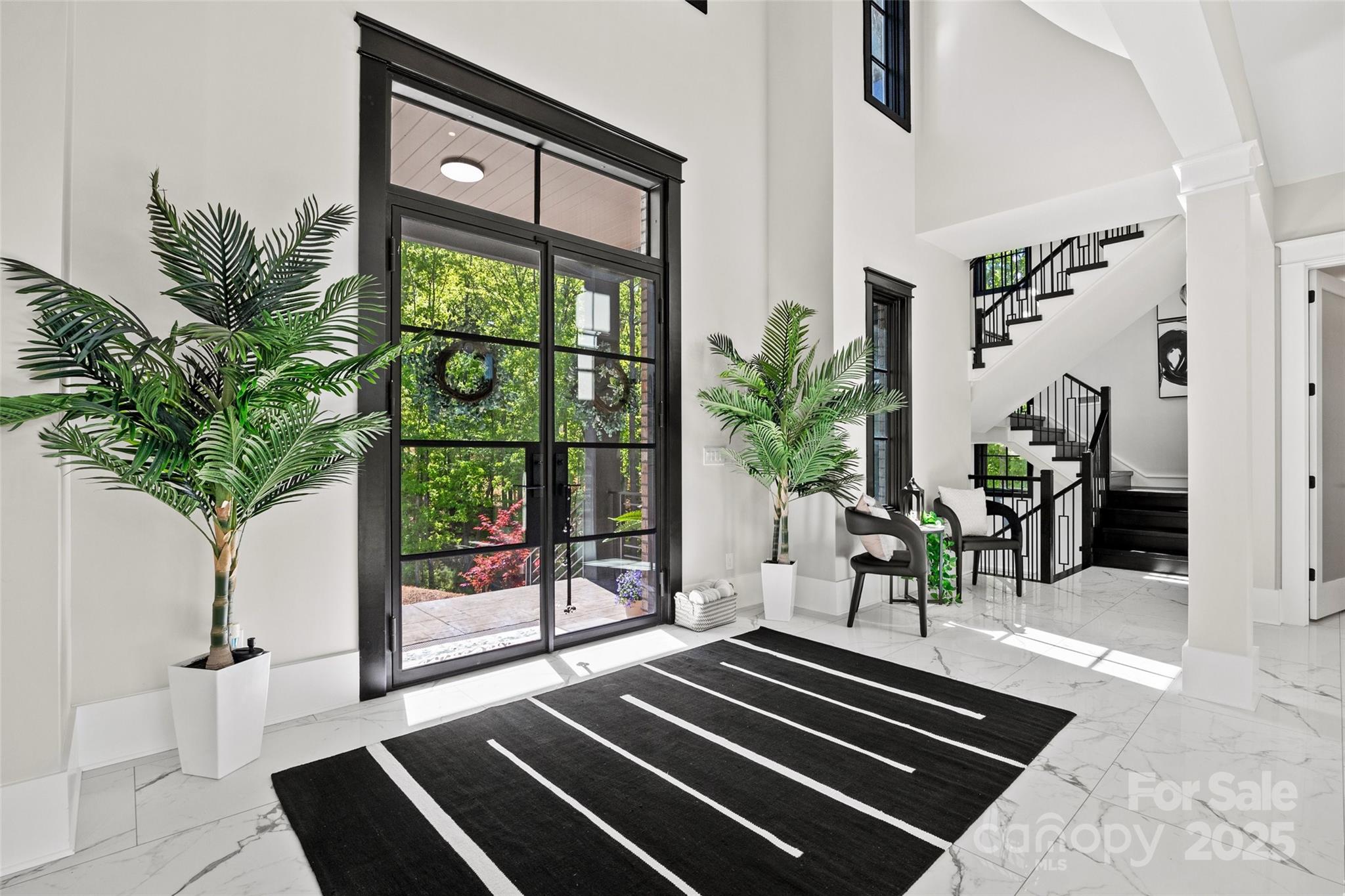 385 Squirrel Lane Lake Wylie, SC 29710 - Photo 5 of 48 a dining room with furniture and a potted plant