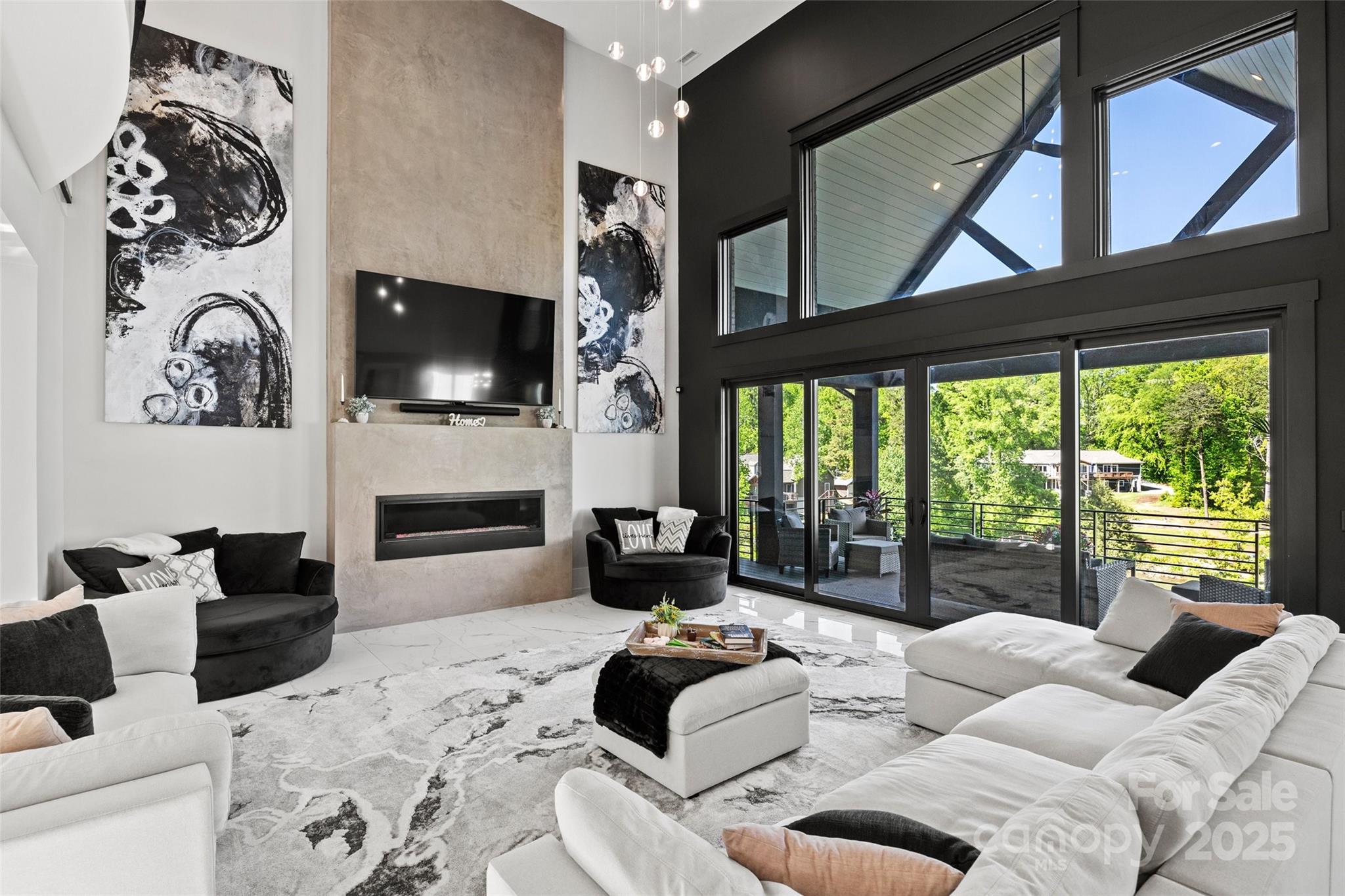 385 Squirrel Lane Lake Wylie, SC 29710 - Photo 6 of 48 a living room with furniture a fireplace and a flat screen tv