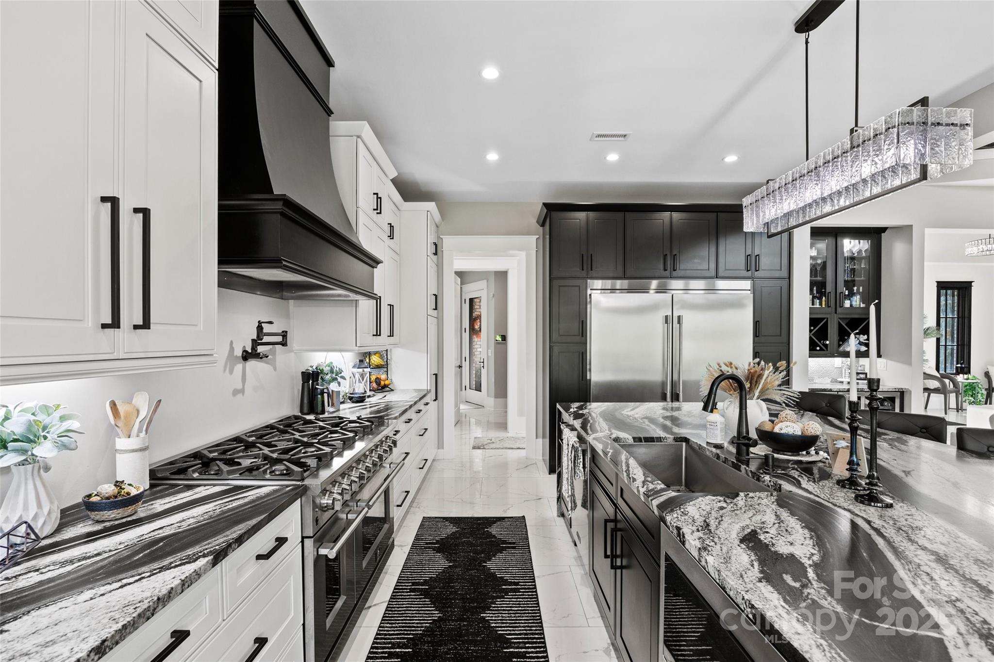385 Squirrel Lane Lake Wylie, SC 29710 - Photo 9 of 48 a kitchen with sink stove and cabinets