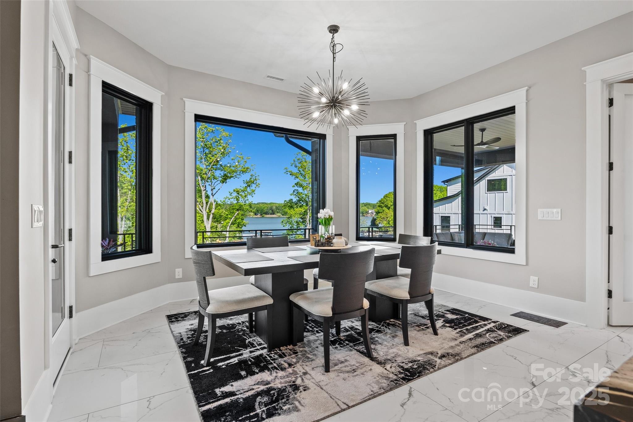 385 Squirrel Lane Lake Wylie, SC 29710 - Photo 10 of 48 a view of a dining room with furniture window and outside view