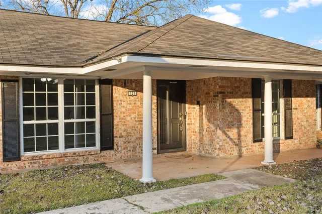 front view of a house with a dry yard