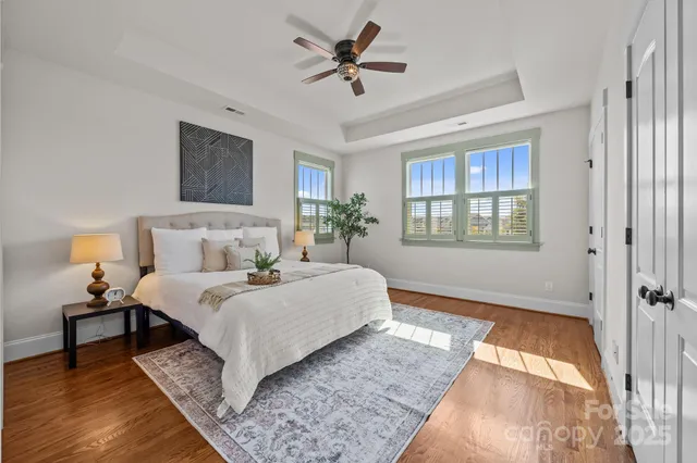 a bedroom with bed and a night stand