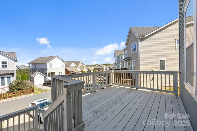 a view of a balcony with wooden floor