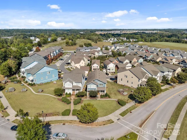 an aerial view of a city with lawn chairs