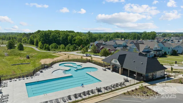 an aerial view of a house with outdoor space