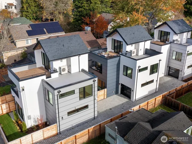 an aerial view of residential houses with deck
