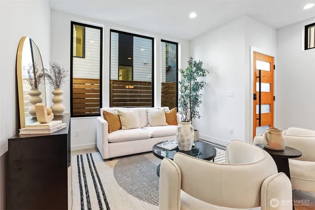 a living room with furniture and a large window