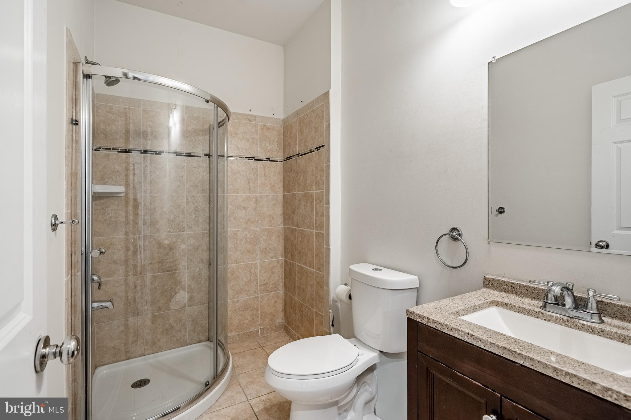 33 Addison Lane Malvern, PA 19355 - Photo 12 of 32 a bathroom with a granite countertop sink toilet and shower