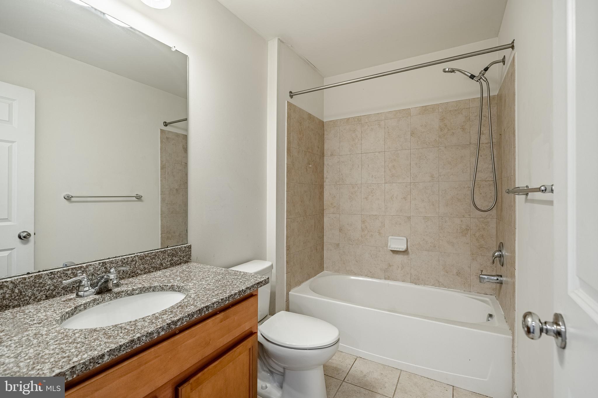 33 Addison Lane Malvern, PA 19355 - Photo 20 of 32 a bathroom with a granite countertop sink toilet mirror and shower